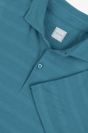 Polo in jersey effetto micro riga petrolio